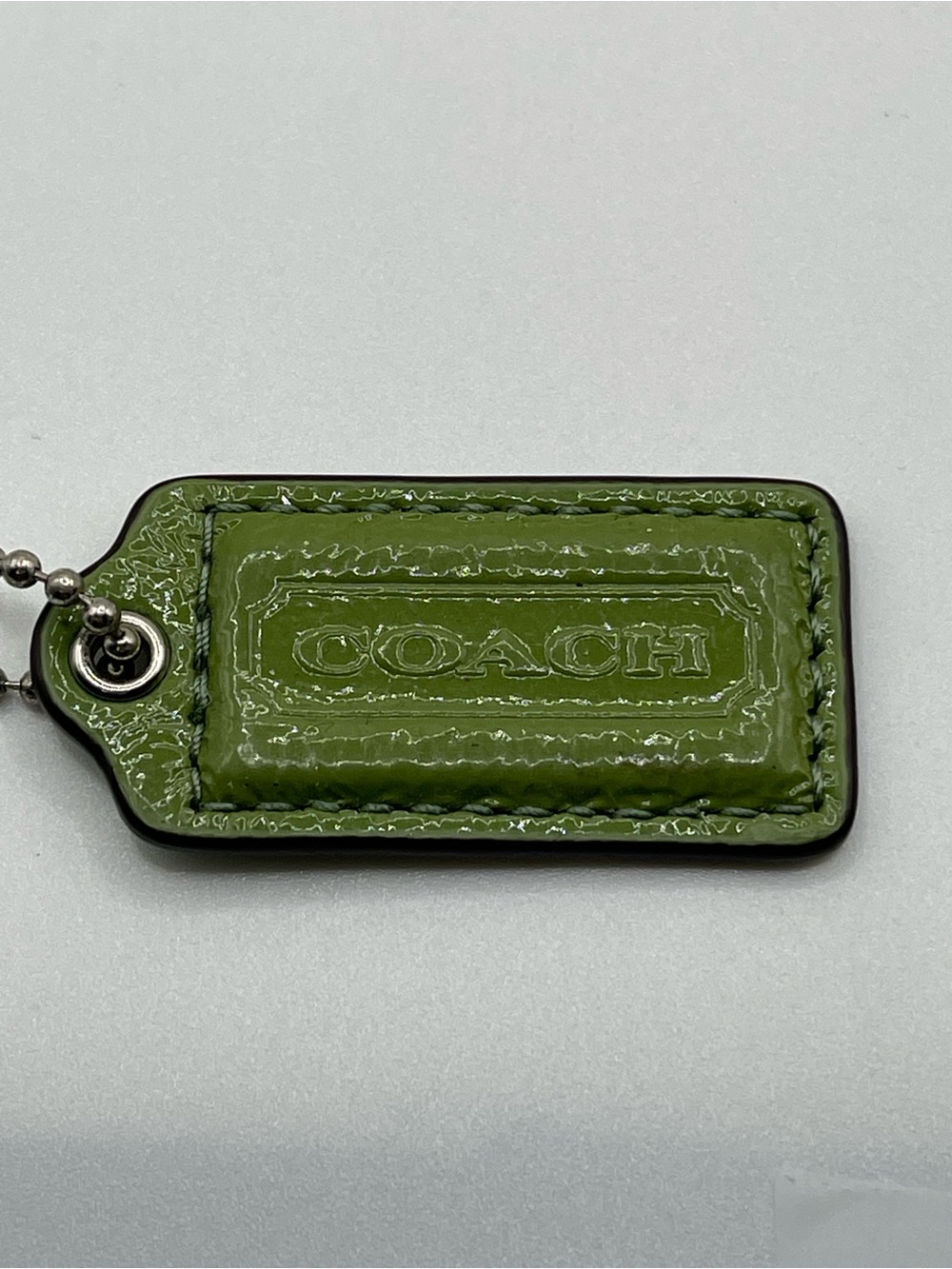 Coach Sage Green Patent Leather Hang Tag Keychain with Silver Chain